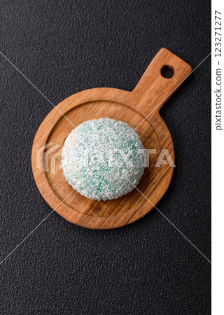 Delicious colorful asian mochi sweets with rice dough shell and fruit filling 123271277