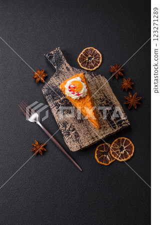 Piece of sweet layer cake with pumpkin or citrus flavor with cream Piece of sweet layer cake with pumpkin or citrus flavor with cream 123271289