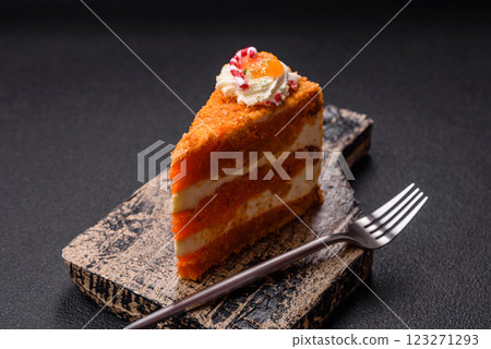 Piece of sweet layer cake with pumpkin or citrus flavor with cream Piece of sweet layer cake with pumpkin or citrus flavor with cream 123271293