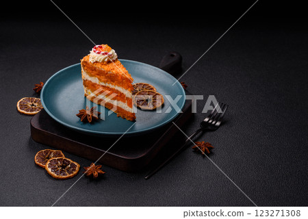 Piece of sweet layer cake with pumpkin or citrus flavor with cream Piece of sweet layer cake with pumpkin or citrus flavor with cream 123271308
