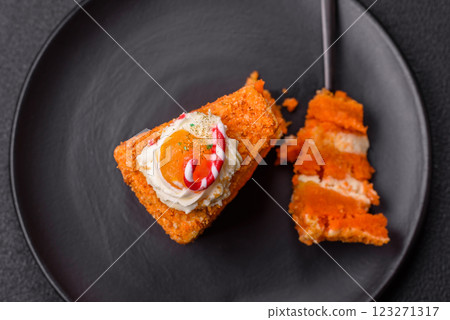 Piece of sweet layer cake with pumpkin or citrus flavor with cream Piece of sweet layer cake with pumpkin or citrus flavor with cream 123271317
