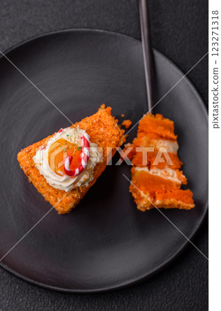 Piece of sweet layer cake with pumpkin or citrus flavor with cream Piece of sweet layer cake with pumpkin or citrus flavor with cream 123271318