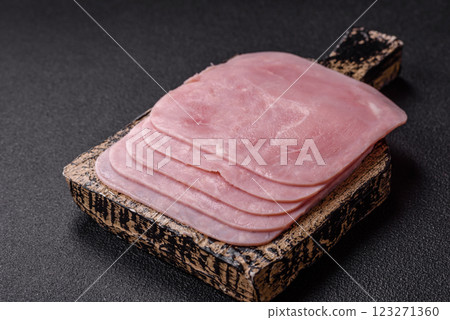 Boiled ham cut into square slices with sorrel and spices Boiled ham cut into square slices with sorrel and spices 123271360