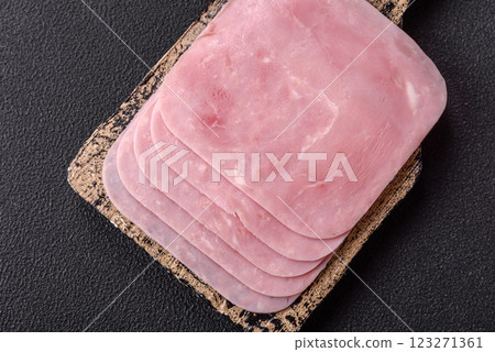 Boiled ham cut into square slices with sorrel and spices Boiled ham cut into square slices with sorrel and spices 123271361