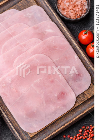 Boiled ham cut into square slices with sorrel and spices Boiled ham cut into square slices with sorrel and spices 123271401