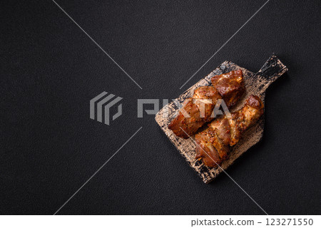 Delicious grilled chicken, turkey or pork skewers with salt, spices and herbs Delicious grilled chicken, turkey or pork skewers with salt, spices and herbs 123271550