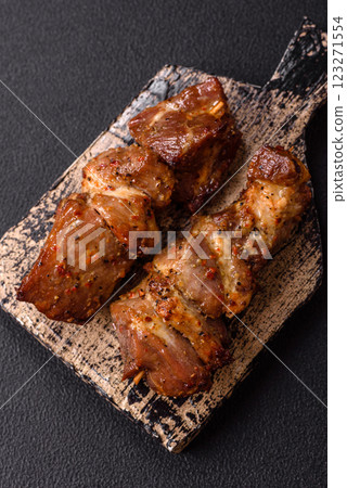 Delicious grilled chicken, turkey or pork skewers with salt, spices and herbs Delicious grilled chicken, turkey or pork skewers with salt, spices and herbs 123271554