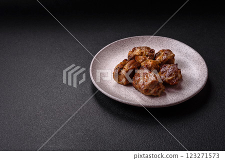 Delicious grilled chicken, turkey or pork skewers with salt, spices and herbs Delicious grilled chicken, turkey or pork skewers with salt, spices and herbs 123271573