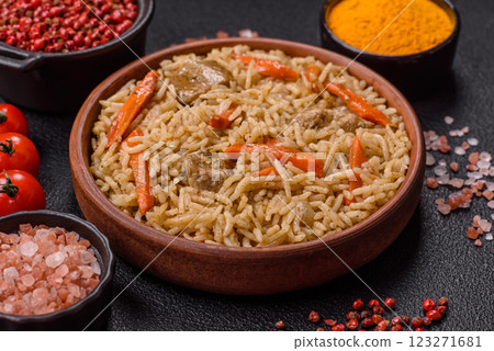 Delicious fresh pilaf with rice, carrots, meat, onions, spices and berries Delicious fresh pilaf with rice, carrots, meat, onions, spices and berries 123271681