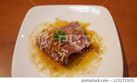 Fresh beef or pork meat steak with butter soy present in a white plate for grill or barbeque. Japanese Wagyu beef steak. Fresh beef or pork meat steak with butter soy present in a white plate for grill or barbeque. Japanese Wagyu beef steak. 123271910