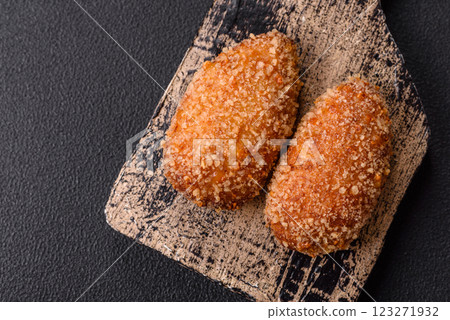 Delicious fresh cutlet or meatball Kiev style with filling 123271932
