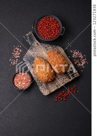 Delicious fresh cutlet or meatball Kiev style with filling 123271938