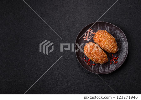 Delicious fresh cutlet or meatball Kiev style with filling 123271940