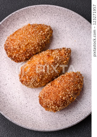 Delicious fresh cutlet or meatball Kiev style with filling 123271957