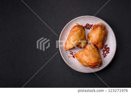 Chicken thighs fried with salt, spices and herbs 123271976