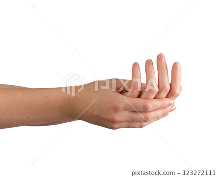 Female hand applying moisturizer to a well-groomed, shiny nail, demonstrating self-care and wellness 123272111
