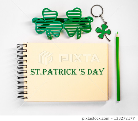 St. Patrick's Day celebration. Green shamrock, lucky charm props, festive mood, and Ireland cultural St. Patrick's Day celebration. Green shamrock, lucky charm props, festive mood, and Ireland cultural 123272177