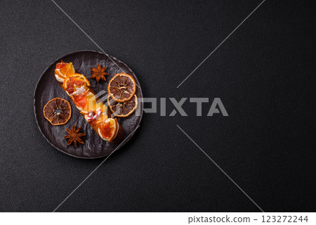 Delicious sweet eclair with chocolate filling, covered with cream Delicious sweet eclair with chocolate filling, covered with cream 123272244