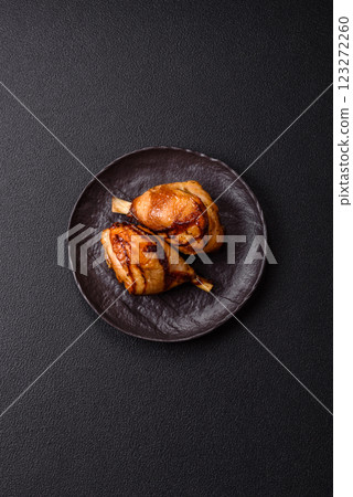 Delicious grilled chicken legs with spices and herbs in teriyaki sauce Delicious grilled chicken legs with spices and herbs in teriyaki sauce 123272260