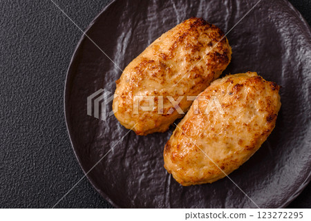 Delicious fresh fried minced fish cutlets with spices and herbs Delicious fresh fried minced fish cutlets with spices and herbs 123272295