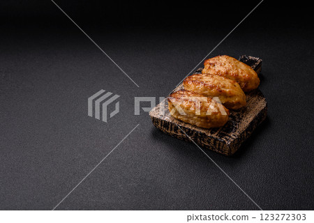 Delicious fresh fried minced fish cutlets with spices and herbs Delicious fresh fried minced fish cutlets with spices and herbs 123272303