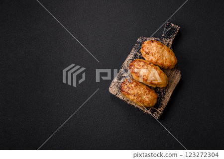 Delicious fresh fried minced fish cutlets with spices and herbs Delicious fresh fried minced fish cutlets with spices and herbs 123272304