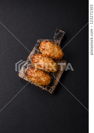 Delicious fresh fried minced fish cutlets with spices and herbs Delicious fresh fried minced fish cutlets with spices and herbs 123272305