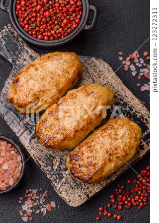 Delicious fresh fried minced fish cutlets with spices and herbs 123272311
