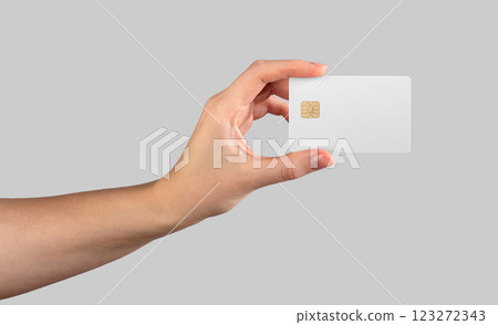 Female hand holding a blank credit card, symbolizing payment, cashback, and financial services. Female hand holding a blank credit card, symbolizing payment, cashback, and financial services. 123272343