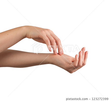 Female hands applying moisturizer with a gentle touch, showcasing healthy, well-groomed nails and Female hands applying moisturizer with a gentle touch, showcasing healthy, well-groomed nails and 123272399