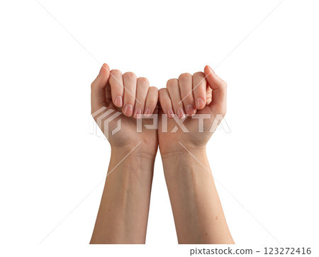 Female hands with glossy, polished nails, gently gesturing and demonstrating self-care and wellness. 123272416