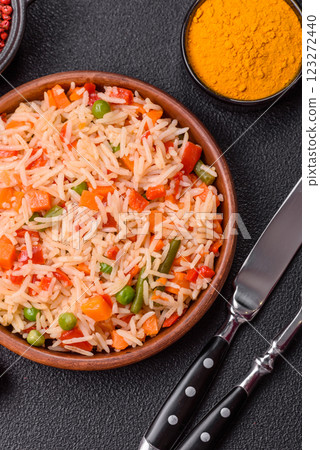 Boiled rice with vegetables, salt and spices Boiled rice with vegetables, salt and spices 123272440