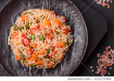 Boiled rice with vegetables, salt and spices Boiled rice with vegetables, salt and spices 123272464