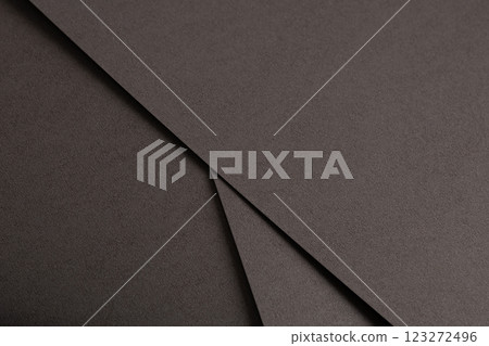 Dark espresso brown paper background with a smooth matte texture and subtle geometric lines Dark espresso brown paper background with a smooth matte texture and subtle geometric lines 123272496