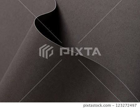 Dark espresso brown paper background with a smooth matte texture and wavy edges. Rich cocoa and Dark espresso brown paper background with a smooth matte texture and wavy edges. Rich cocoa and 123272497