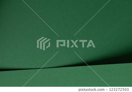 Deep emerald green paper background with a smooth texture and elegant folds. Rich forest and pine 123272503