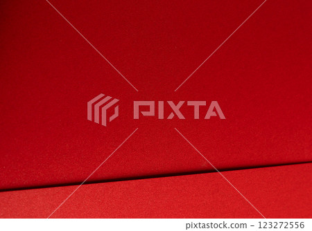 Fiery crimson paper background with a smooth texture and geometric lines. Rich scarlet tones and a Fiery crimson paper background with a smooth texture and geometric lines. Rich scarlet tones and a 123272556