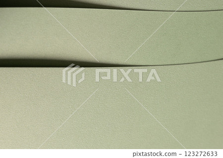 Pastel sage green paper background with a soft texture and layered folds. Muted olive and moss tones Pastel sage green paper background with a soft texture and layered folds. Muted olive and moss tones 123272633