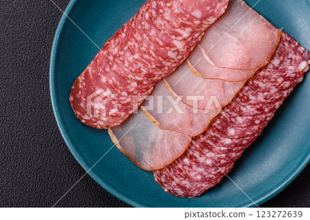Delicious fresh smoked sausages cut with slices 123272639