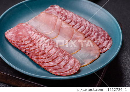 Delicious fresh smoked sausages cut with slices 123272641