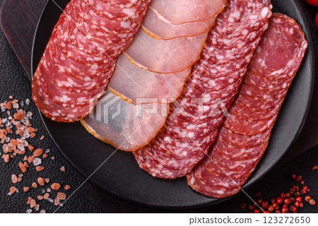Delicious fresh smoked sausages cut with slices 123272650