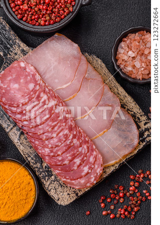 Delicious fresh smoked sausages cut with slices 123272664