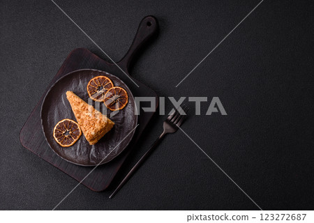 Piece of sweet layer cake Napoleon with custard 123272687