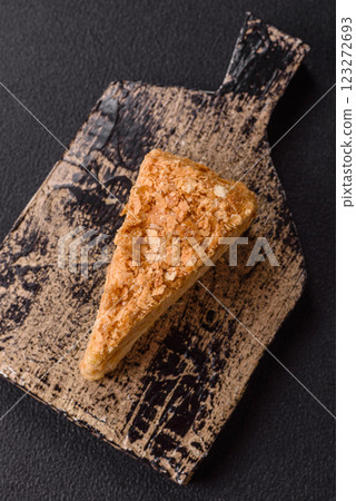 Piece of sweet layer cake Napoleon with custard 123272693