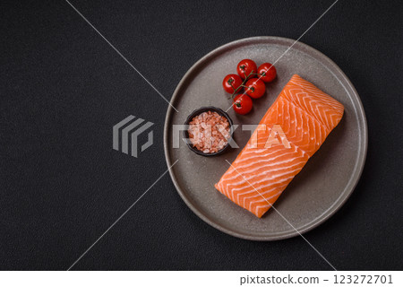 Fresh raw salmon steak with spices and herbs Fresh raw salmon steak with spices and herbs 123272701