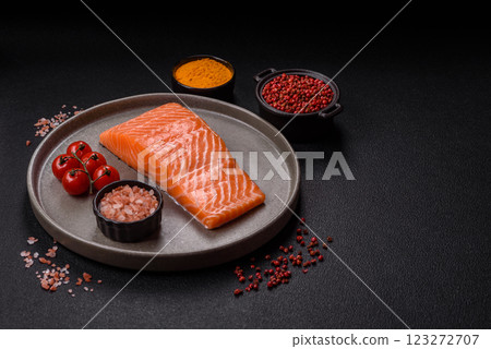 Fresh raw salmon steak with spices and herbs Fresh raw salmon steak with spices and herbs 123272707