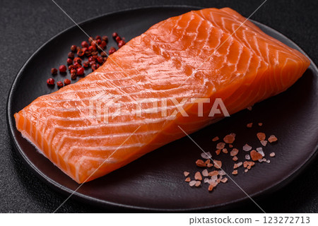 Fresh raw salmon steak with spices and herbs Fresh raw salmon steak with spices and herbs 123272713