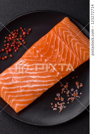 Fresh raw salmon steak with spices and herbs 123272714