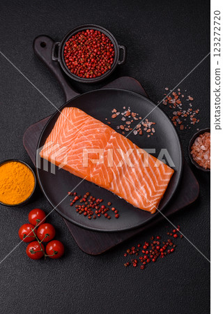 Fresh raw salmon steak with spices and herbs 123272720