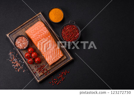 Fresh raw salmon steak with spices and herbs 123272730